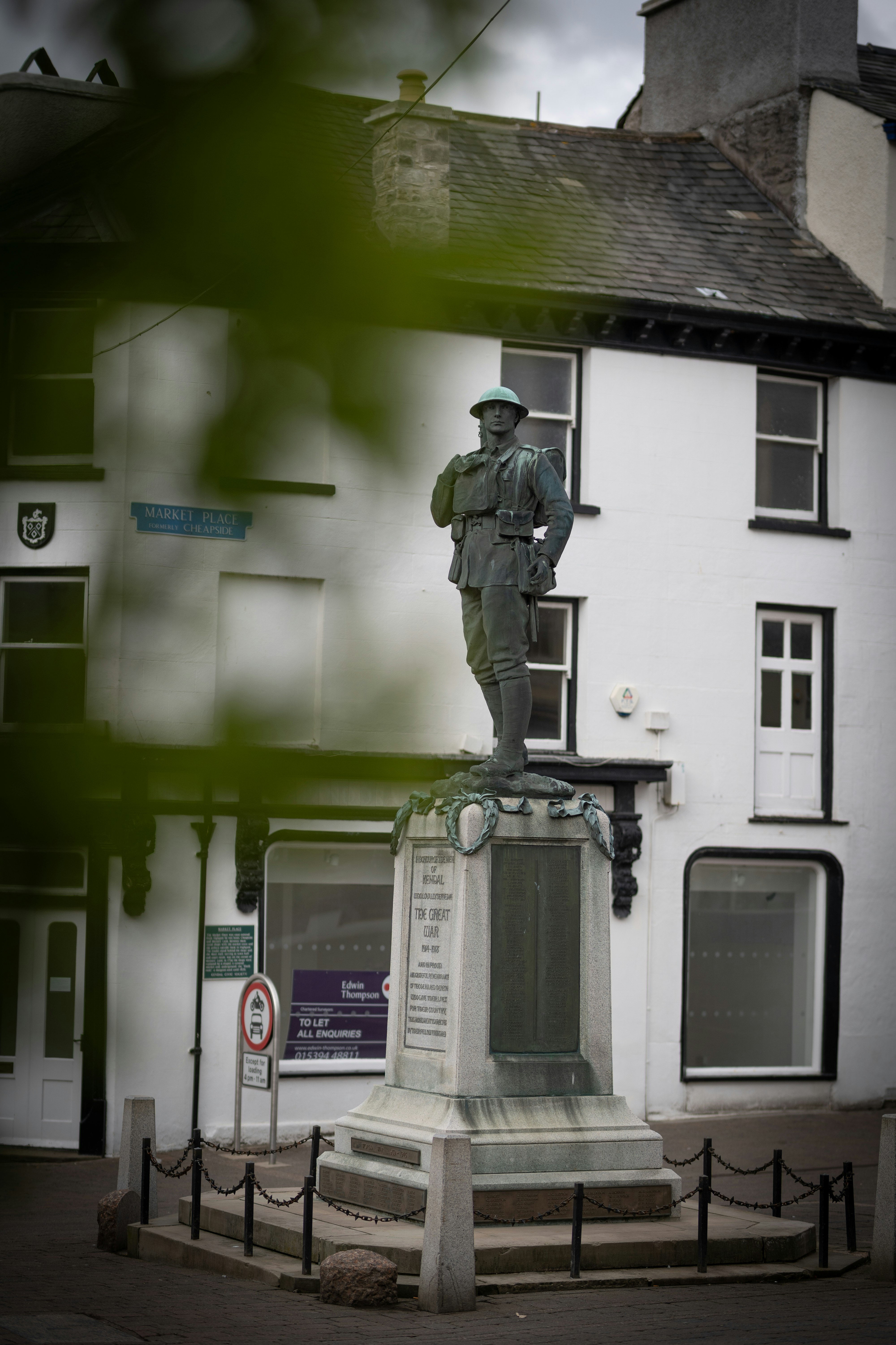 man in black jacket statue